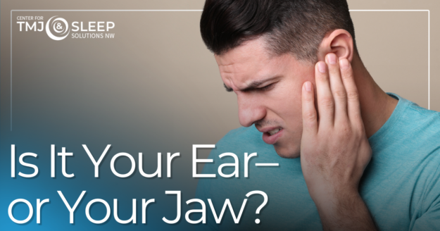 man holding his jaw in pain