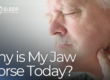 man holding jaw in pain